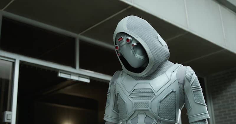 The ghost wears a white-hooded suit with red hoses on the forehead.