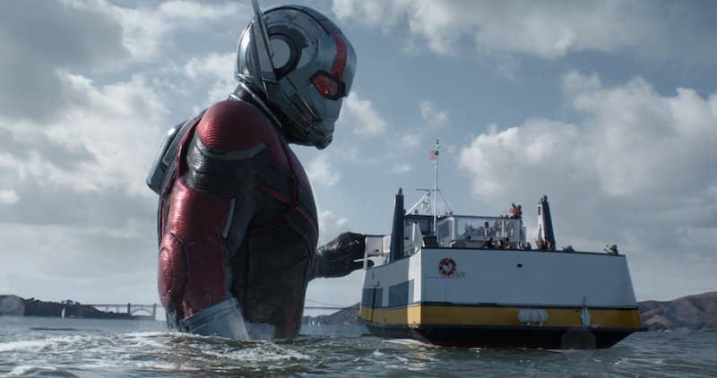Ant-Man stands in the San Francisco bay, towering over a rescue boat.