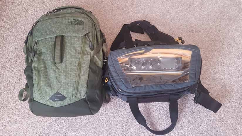 A backpack and a bag with a digital recorder sit next to each other