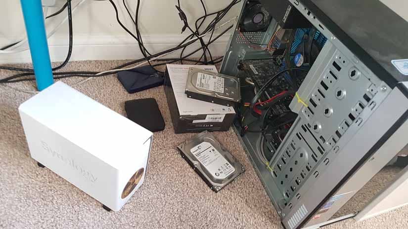 Towers and hard drives sit on the floor