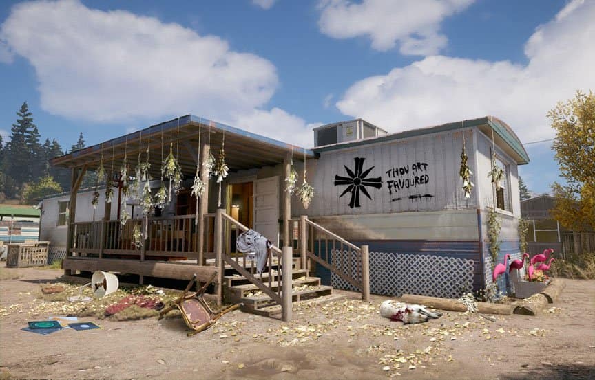 A mobile home has a religious symbol and the words “Thou Art Favoured” on the side. 