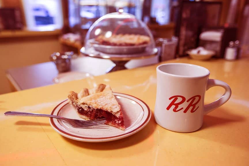 A slice of cherry pie and a cup of damn good coffee... and hot!