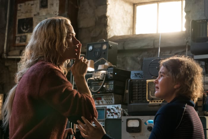 A woman hushes a worried child in the basement.