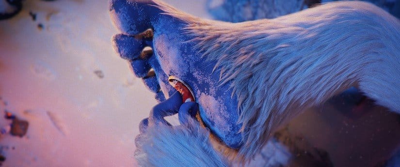 The yeti compares the boy's tiny shoe to his own gigantic foot.