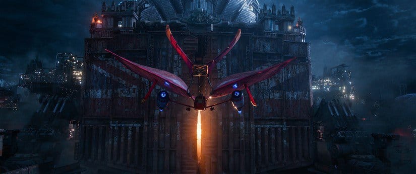 A red airship approaches the London traction city.