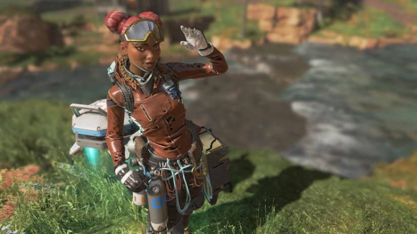 A soldier with medical supplies waves her hand.