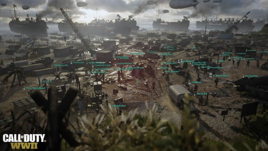A unit sets up on a beach with each soldiers role labeled by the user interface.